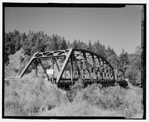 Side view of the old highway river bridge